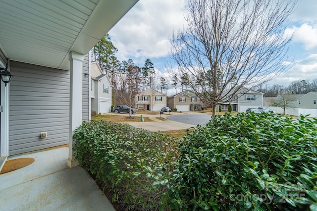 view of yard featuring a residential view