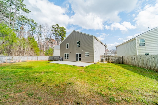 back of property with a patio, a lawn, cooling unit, and a fenced backyard