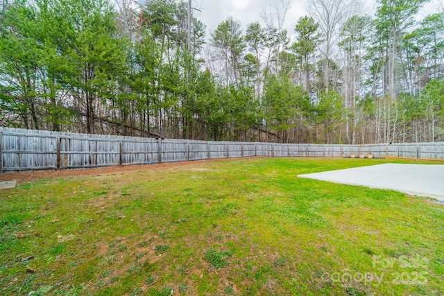 view of yard with a fenced backyard