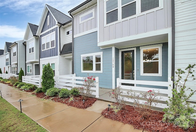 view of front of home with board and batten siding and a residential view