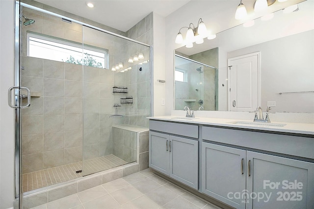 bathroom featuring a stall shower and a sink