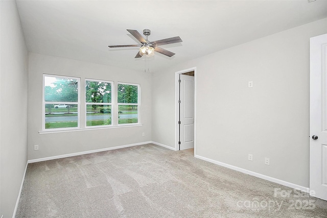 empty room featuring carpet, ceiling fan, and baseboards