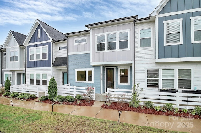 townhome / multi-family property featuring board and batten siding