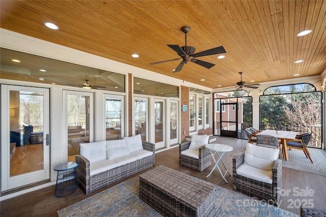 view of patio with an outdoor living space and a ceiling fan