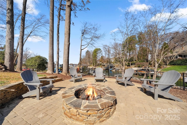 view of patio with fence and an outdoor fire pit