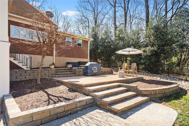view of yard featuring stairs, a patio area, and fence
