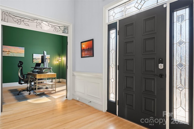 entrance foyer with plenty of natural light and wood finished floors