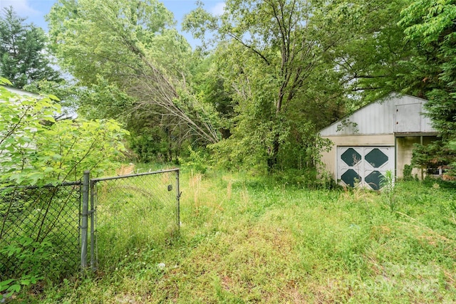 133 Proctor St, Gastonia, NC 28052 - view of yard with an outdoor structure and fence