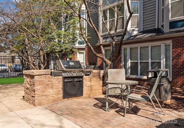 view of patio / terrace featuring area for grilling, grilling area, and fence