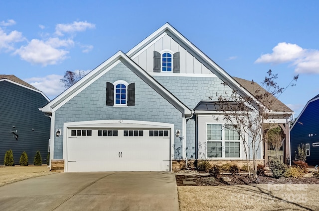 view of front of property featuring an attached garage, board and batten siding, and concrete driveway