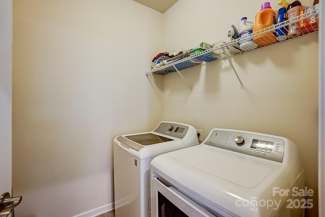 laundry room with washer and dryer and laundry area