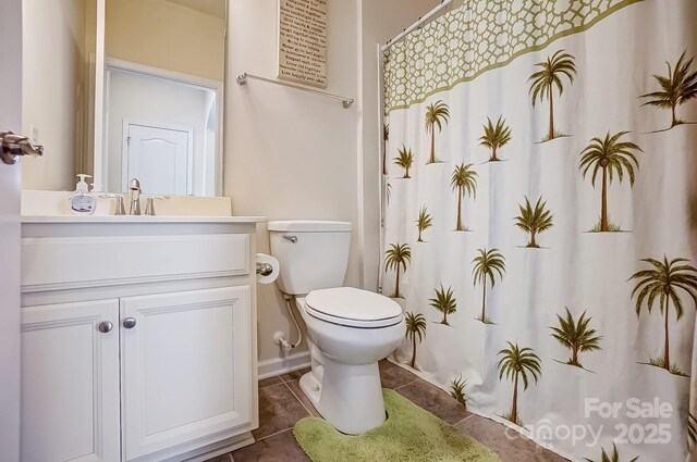 bathroom featuring toilet, tile patterned floors, a shower with shower curtain, and vanity