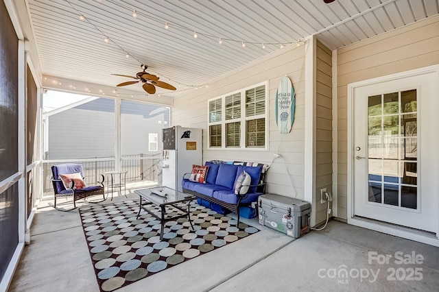 sunroom featuring ceiling fan