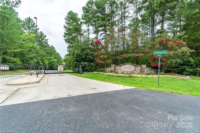 exterior space with a gate and a gated entry