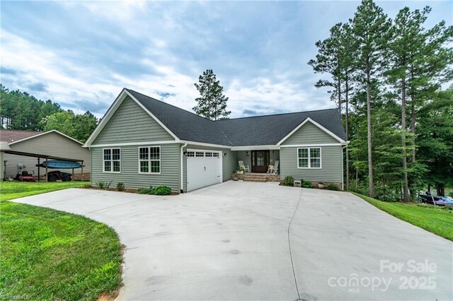 ranch-style house with a garage, a front lawn, and concrete driveway