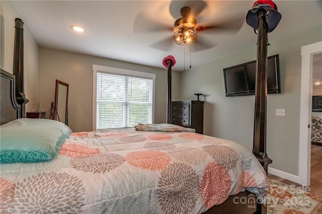 bedroom featuring ceiling fan, recessed lighting, wood finished floors, and baseboards