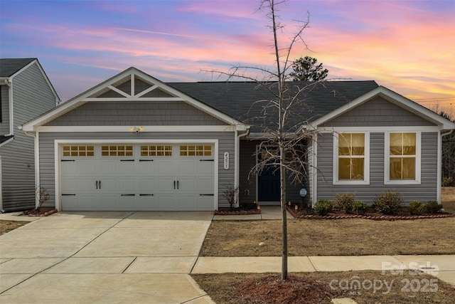 view of front of home featuring a garage and concrete driveway