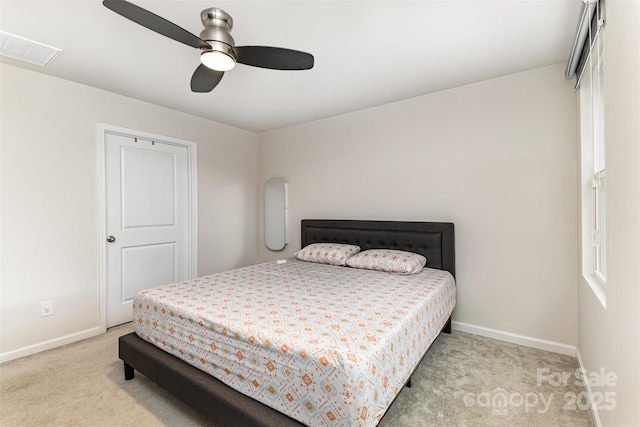 bedroom featuring carpet floors, visible vents, baseboards, and a ceiling fan