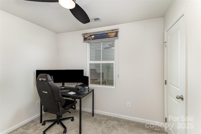 office area with carpet floors, visible vents, ceiling fan, and baseboards