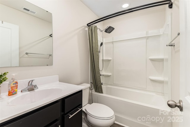 bathroom featuring shower / bath combo, visible vents, vanity, and toilet