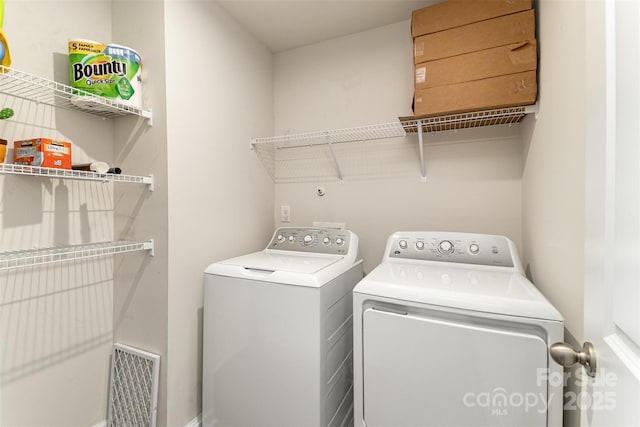 laundry area with laundry area and washing machine and dryer