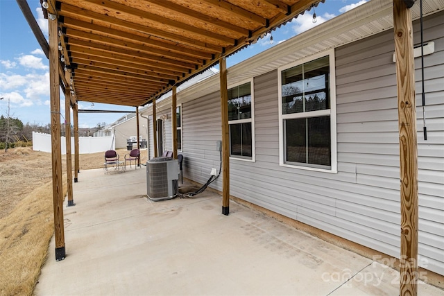 view of patio / terrace with fence and central air condition unit