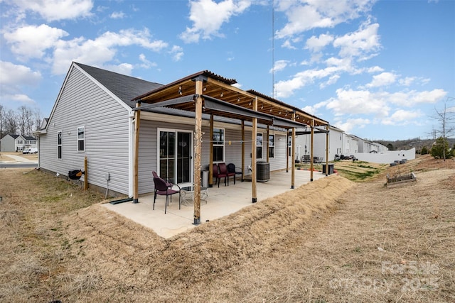 back of property featuring central AC and a patio