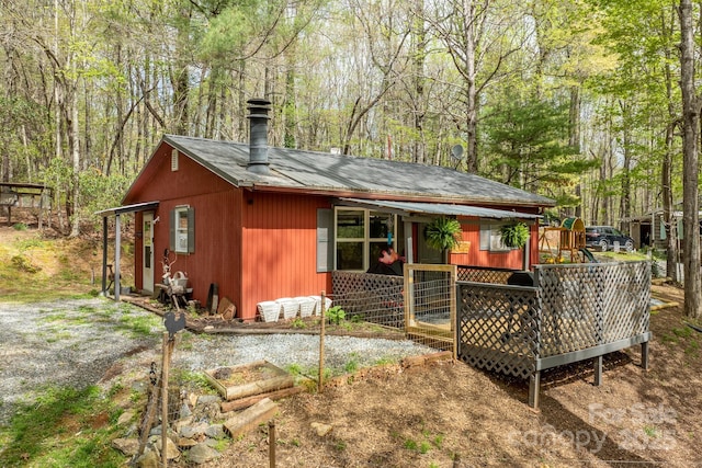 view of outdoor structure with a wooded view