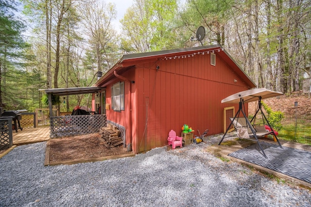 view of side of property featuring a deck