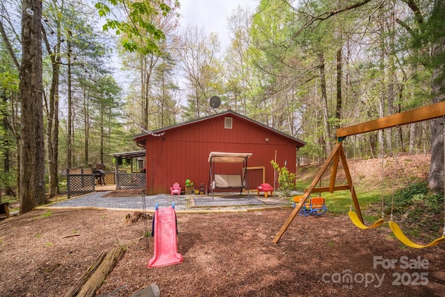 view of outdoor structure with a playground