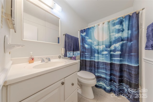 bathroom featuring tile patterned flooring, a shower with shower curtain, toilet, and vanity