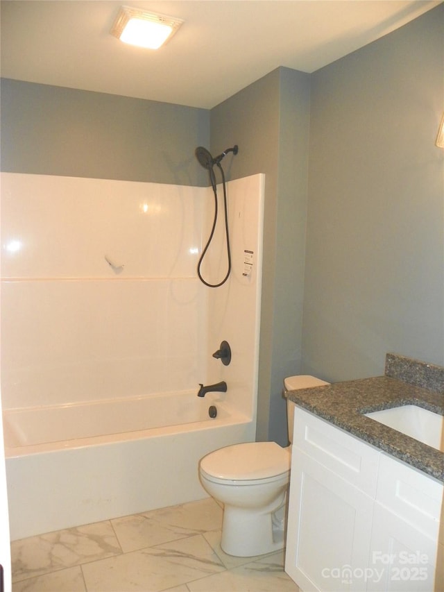 bathroom with marble finish floor, vanity, toilet, and shower / bathtub combination