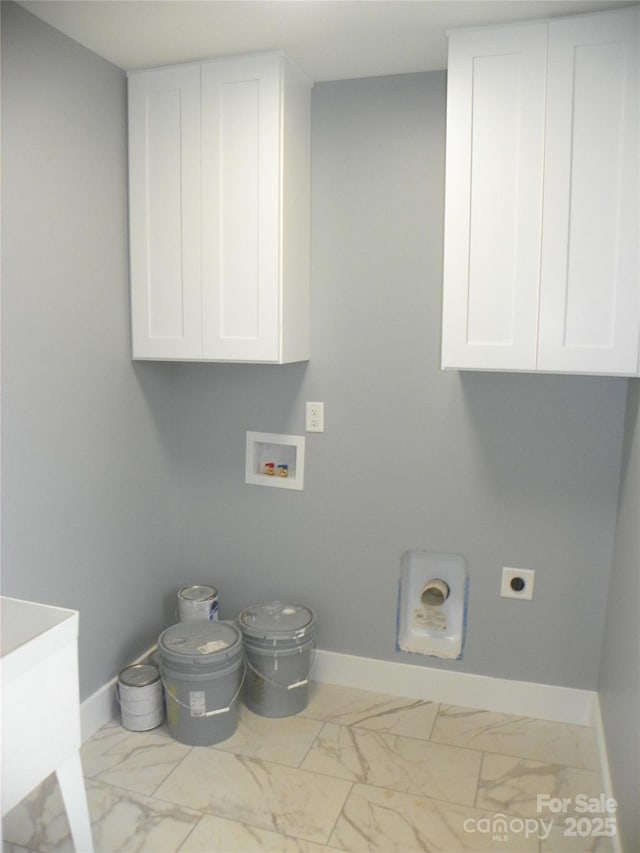 laundry area featuring washer hookup, marble finish floor, cabinet space, hookup for an electric dryer, and baseboards