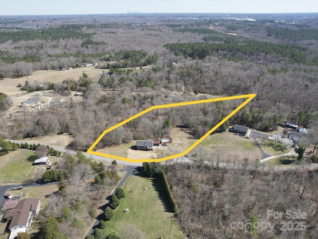 aerial view featuring a view of trees