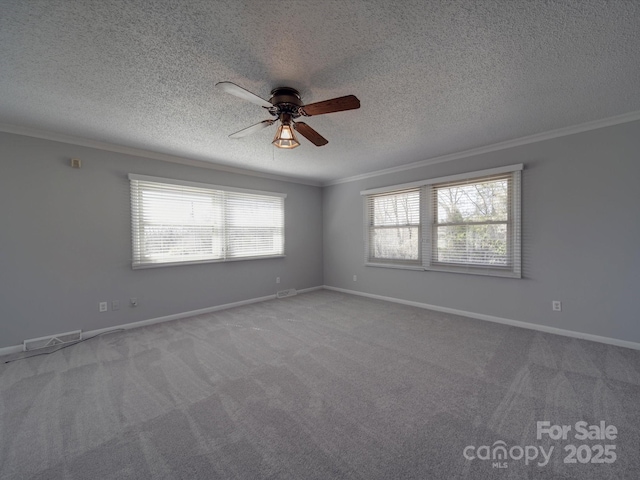 unfurnished room featuring carpet, a healthy amount of sunlight, and crown molding