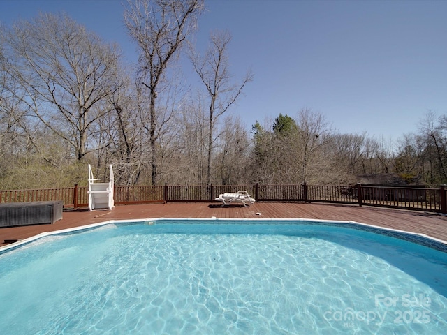 view of pool with a deck