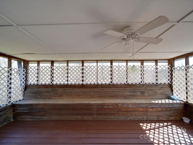 wooden terrace featuring ceiling fan