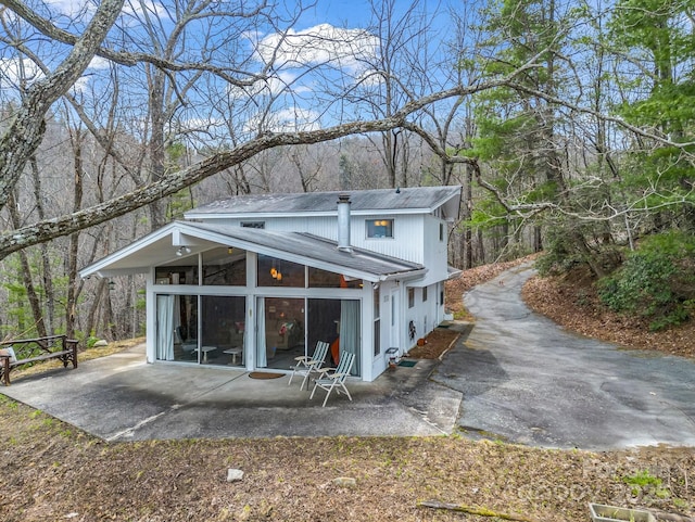 675 Foster Hill Dr, Hendersonville, NC 28739 - rear view of property featuring a patio area and a sunroom