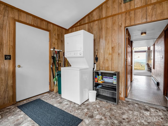 675 Foster Hill Dr, Hendersonville, NC 28739 - clothes washing area featuring wooden walls, stacked washer and clothes dryer, and a baseboard radiator
