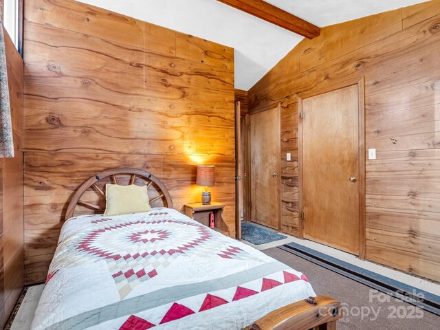 675 Foster Hill Dr, Hendersonville, NC 28739 - bedroom with lofted ceiling with beams, carpet, and wood walls