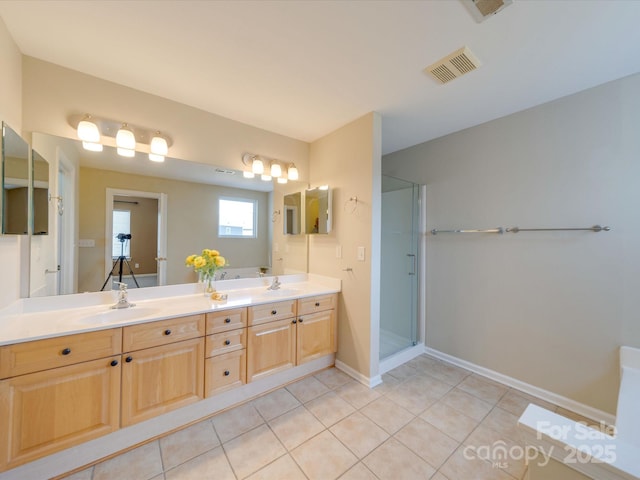 full bath featuring a shower stall, visible vents, a sink, and tile patterned floors