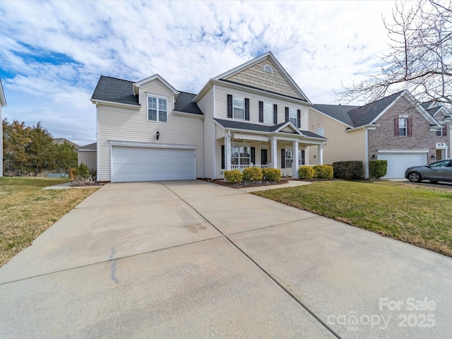 traditional home featuring driveway, covered porch, a front lawn, and a garage