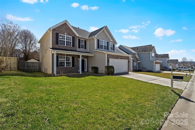 traditional home featuring a garage, brick siding, fence, driveway, and a front yard