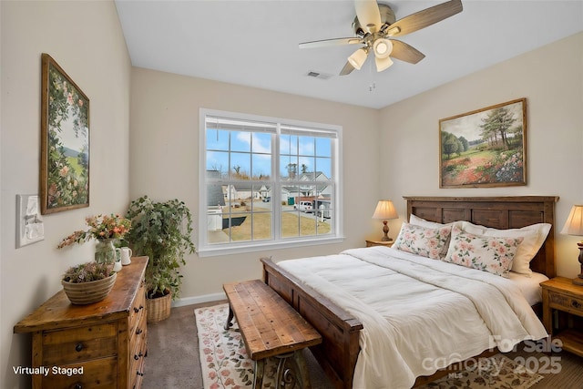 bedroom with ceiling fan, carpet, visible vents, and baseboards