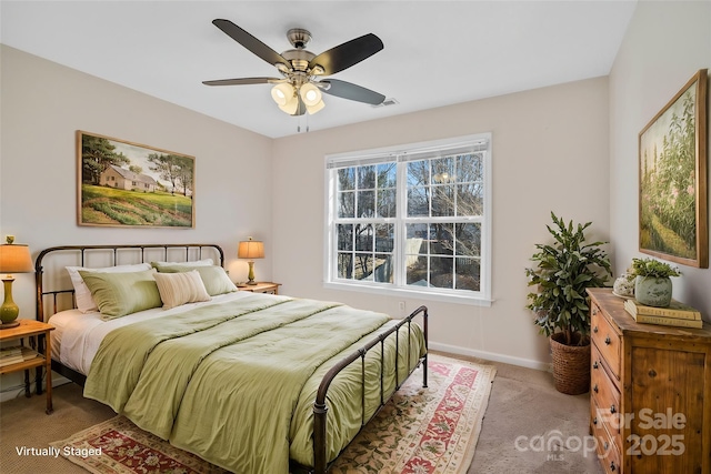 bedroom with visible vents, baseboards, ceiling fan, and light colored carpet