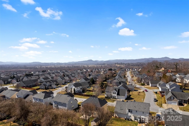 bird's eye view featuring a mountain view and a residential view