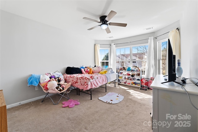 bedroom with a ceiling fan, baseboards, visible vents, and carpet flooring