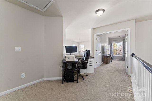 office with light carpet, attic access, and baseboards