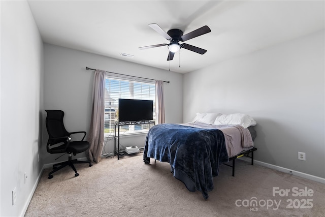 bedroom featuring carpet floors, baseboards, visible vents, and ceiling fan