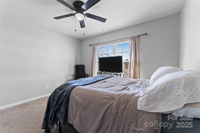 bedroom featuring ceiling fan, carpet floors, visible vents, and baseboards